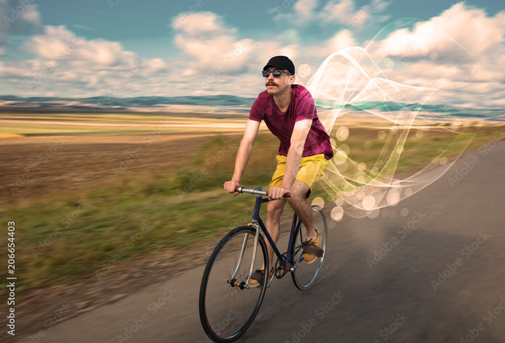 Gorgeous biker in the nature going somewhere with ethereal concept Gorgeous biker in the nature going somewhere with ethereal concept