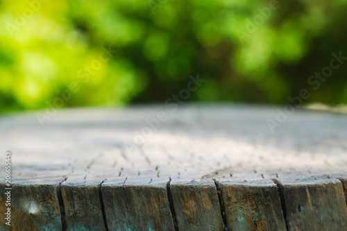 Rustic Wooden Floor Board and Bokeh Blur Summer Garden Background Copy Space