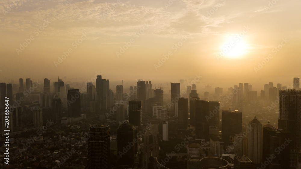 Silhouette of Jakarta skyscrapers at sunset time
