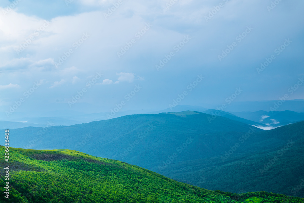 Fototapeta premium tops of the mountains and rainy clouds of the landscape 