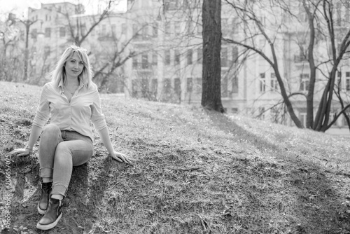 A woman of plus size  American or European appearance walks in the city enjoying life. A young lady with excess weight  xl size at the center of the city. Natural beauty  