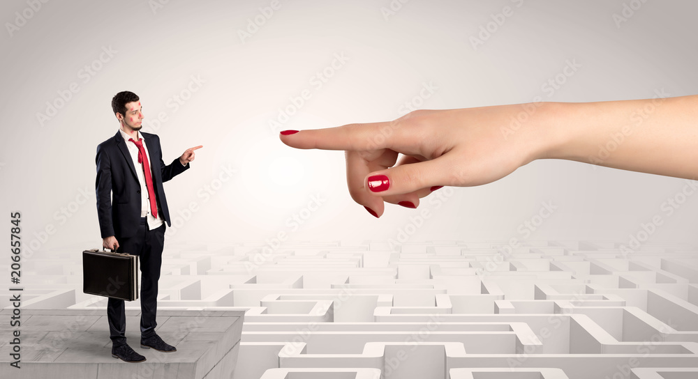 Young businessman blindly in love in the middle of an infinity maze concept
