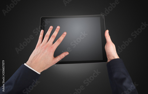 Wallpaper Mural Hand using tablet with no concept and empty space
 Torontodigital.ca