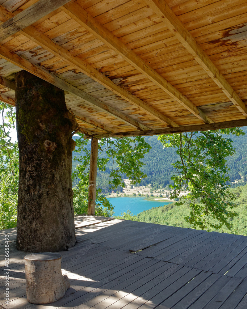 view of blue water mountain lake from an old open shed view of blue water mountain lake from an old open shed