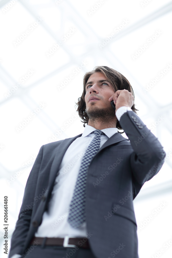 businessman talking on mobile .isolated on white. businessman talking on mobile .isolated on white.