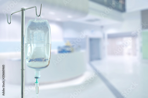 saline bag and hospital blurry background