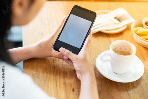 Play the mobile phone and drinking coffee in the morning.