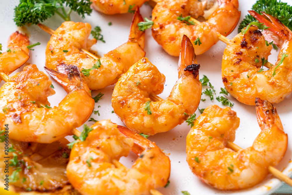 Grilled tiger shrimps skewers with lemon Grilled tiger shrimps skewers with lemon