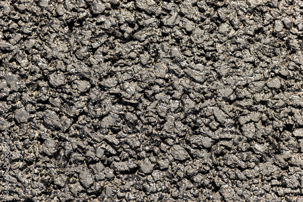 The texture of the roadway is asphalt. Close-up The texture of the roadway is asphalt. Close-up