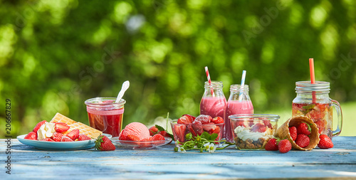 Vibrant summer berry smoothie bowls and juices photo