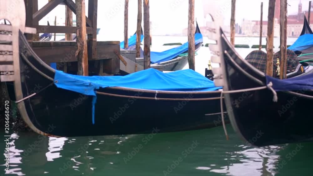 Rows of traditional wooden gondolas Rows of traditional wooden gondolas