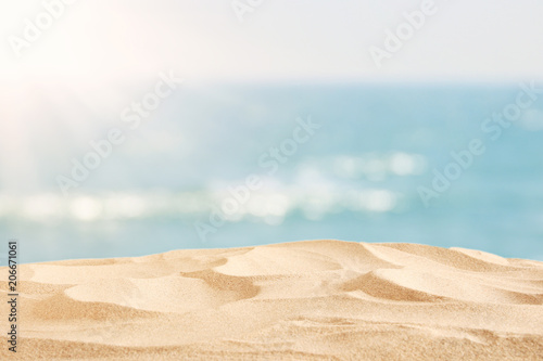 Empty sand beach in front of summer sea background with copy space.