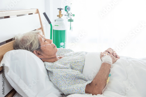 Asian senior female patient sleeping on bed in hospital photo