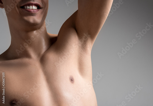 Tableau sur toile Close up of armpit of cheerful young shirtless man