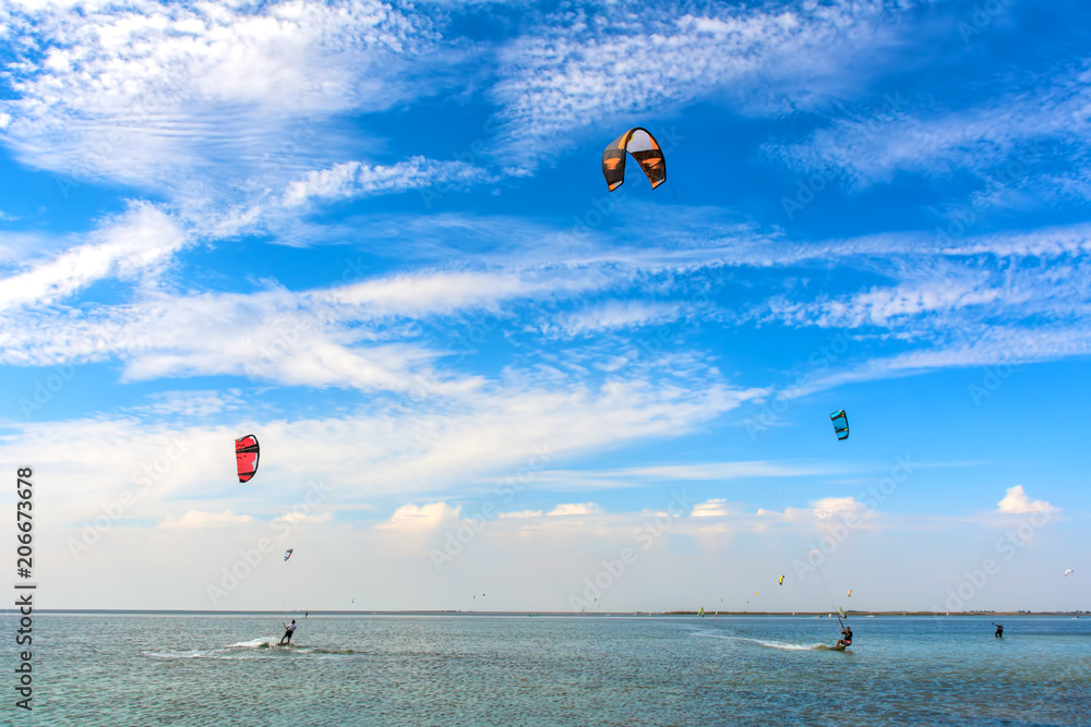Kiteboarding. A kite surfers rides the waves. Recreational activities, water sports, hobbies and fun in summer. Artistic picture. Beauty world. Kiteboarding. A kite surfers rides the waves. Recreational activities, water sports, hobbies and fun in summer. Artistic picture. Beauty world.
