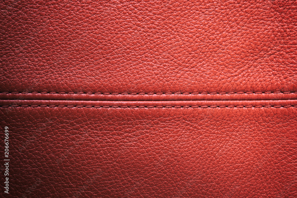 Closeup red leather with sewing seam for background Closeup red leather with sewing seam for background