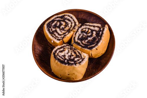 Ceramic plate with poppy seed buns isolated on a white background