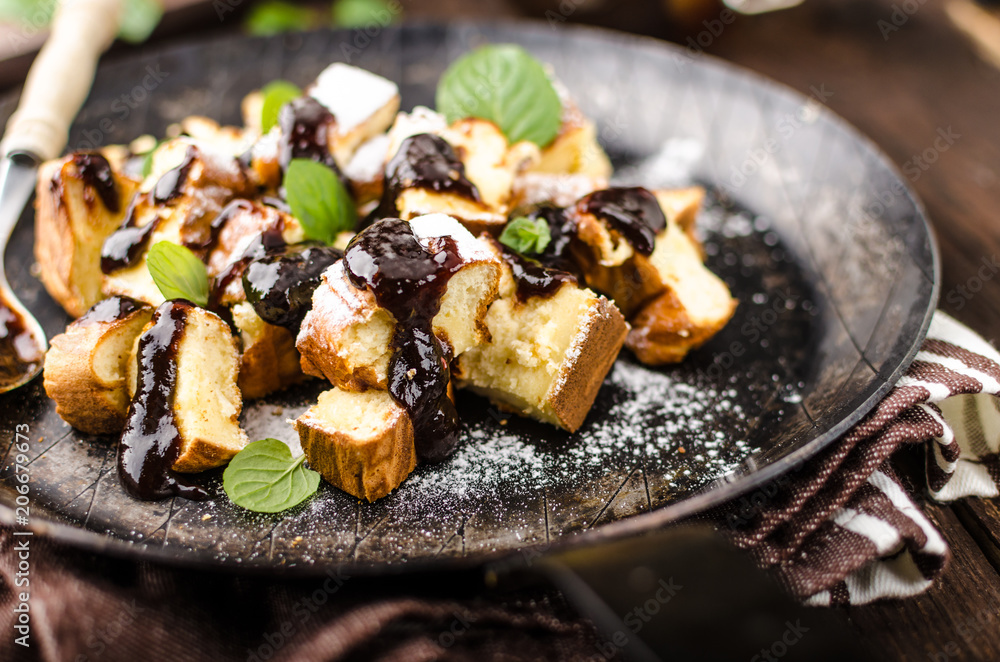 Cutted pancakes, Kaiserschmarrn delish dessert with plums Cutted pancakes, Kaiserschmarrn delish dessert with plums