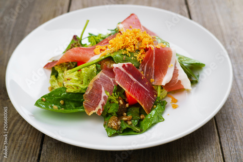 Prosciutto and spinach salad, rdelicious appetizing meals for foodie. Mediterranean food, appetizer, banquet, restaurant menu, dining concept