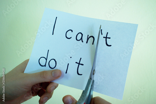 Closeup of hands cutting a piece of paper with 