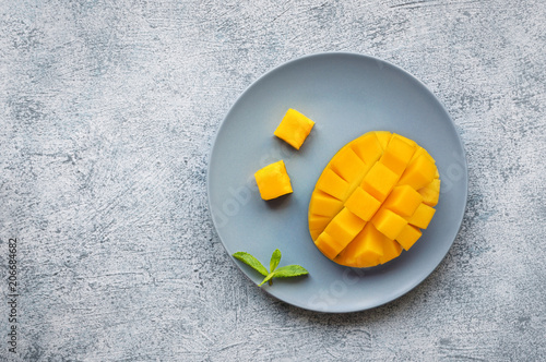 Tableau sur toile Sliced ripe mango fruit on concrete background