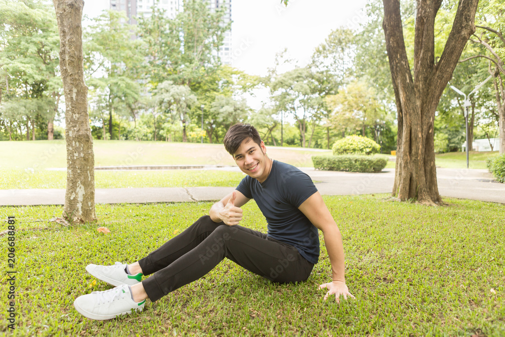 A young sportsman getting ready for athletic and fitness training outdoors. Healthy lifestyle concept with sunrise early morning. A young sportsman getting ready for athletic and fitness training outdoors. Healthy lifestyle concept with sunrise early morning.