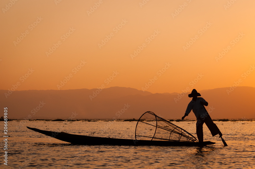 fisherman on a boat silhouette inle lake