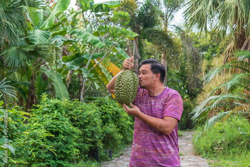 Asian farmer holding Durian is a king of fruit © pongmoji