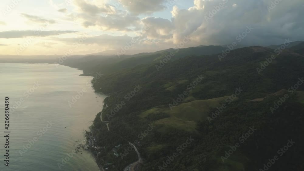 custom made wallpaper toronto digitalAerial view of seashore with beach and mountains with sky and clouds at sunset. Philippines, Luzon. View of the ocean with the coastline. Tropical landscape in Asia.