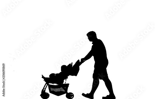  silhouette father carrying his son out of a wheelchair on out door.
