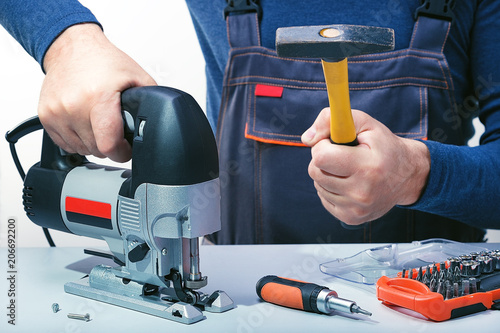 Wallpaper Mural Professional technician working in repair service. Repairing power tools.Problem in repair. Torontodigital.ca