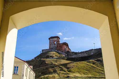 Right wing of Gediminas Castle in Vilnius Lithunia, framed by a yellow wall photo