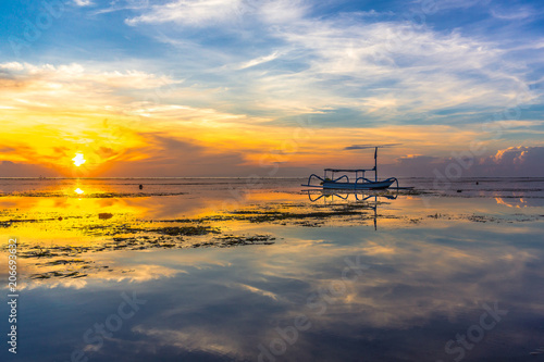 An old traditional indonesian fishing boat at sunrise