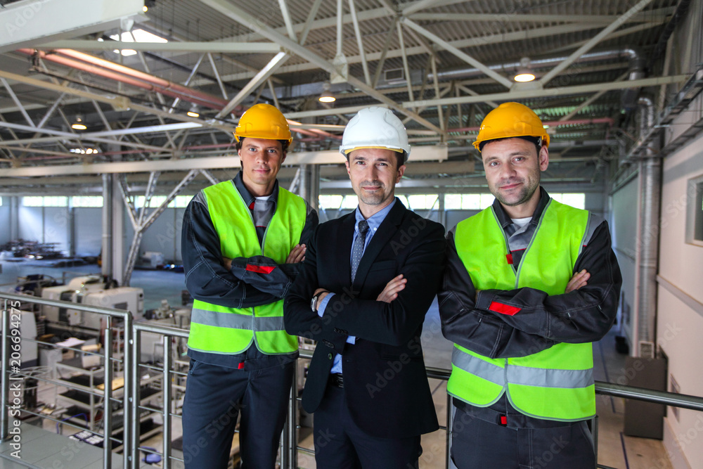 Manager and workers in factory Manager and workers in factory