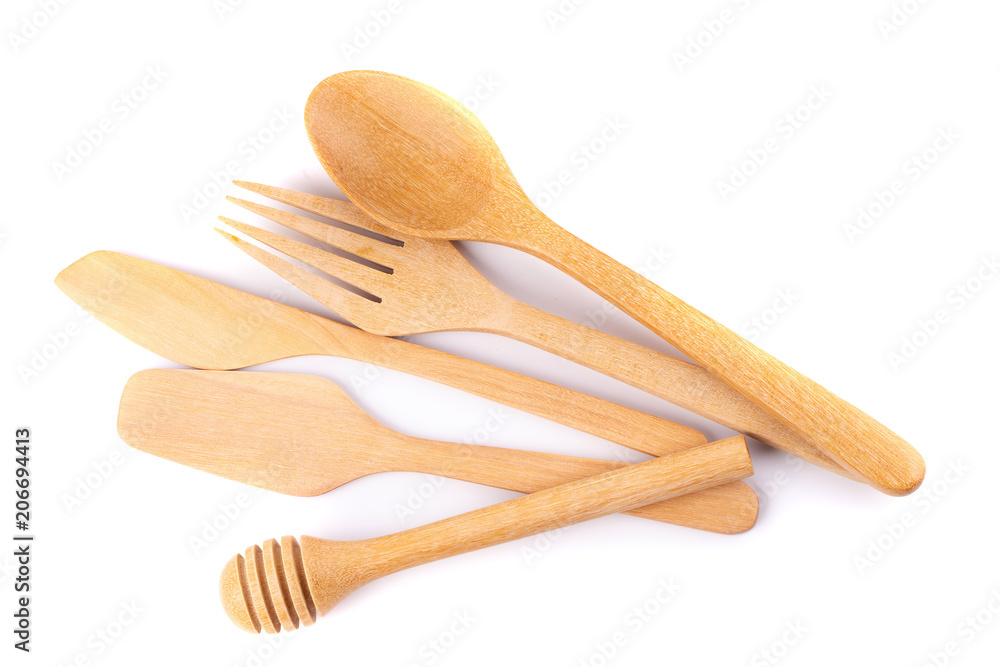 Set of wooden cutlery in Wicker baskets isolated on a white background Set of wooden cutlery in Wicker baskets isolated on a white background