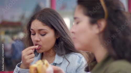 Closeup Of Friends Really Enjoying Their Burgers And Fries, On Santa Monic Pier (Shot On Red Scarlet-W Dragon In 4K, Slow Motion)
