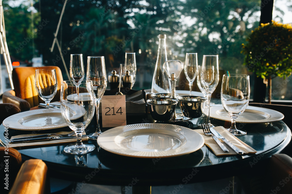 table setting in a luxurious restaurant before a gastronomic dinner.