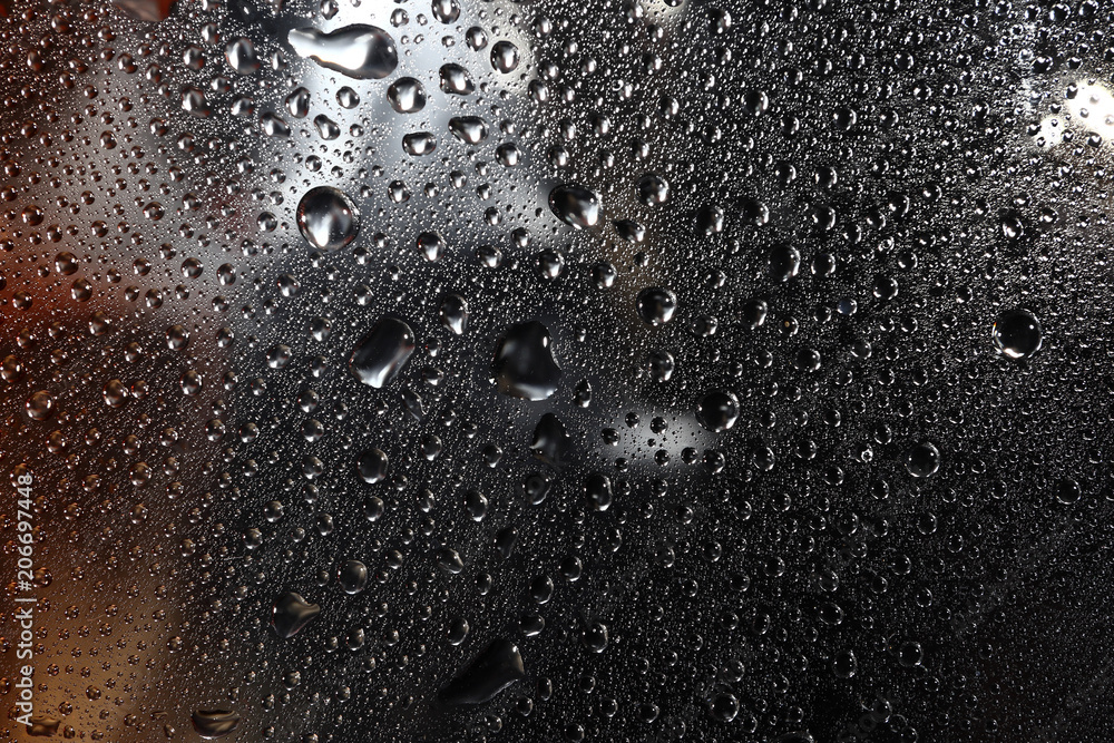 liquid droplets on a transparent surface liquid droplets on a transparent surface
