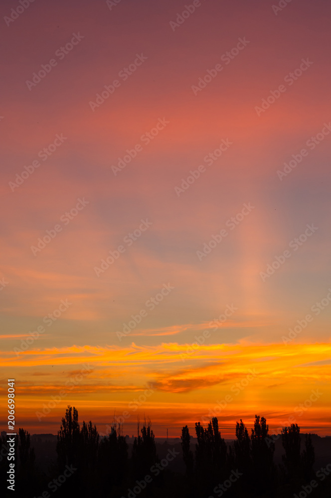 Landscape with dramatic light - beautiful golden sunset with saturated sky and clouds. Landscape with dramatic light - beautiful golden sunset with saturated sky and clouds.