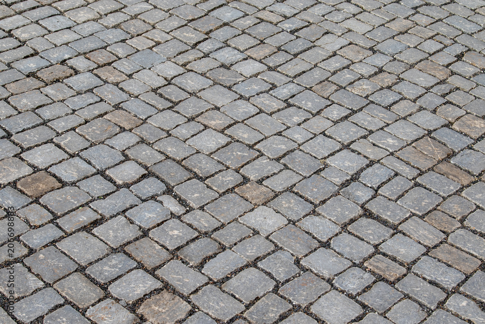 Surface of an old street with cobblestones