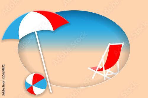 Umbrella, beach chair and ball on summer beach