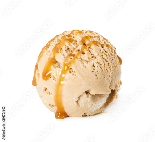 Ball of ice cream creme brulee with caramel syrup isolated on white