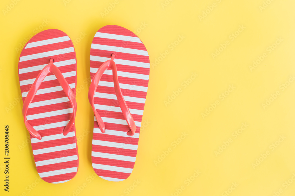 Flip flops on a yellow background Flip flops on a yellow background