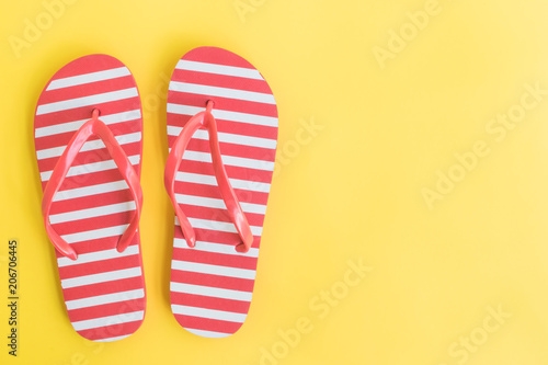 Flip flops on a yellow background