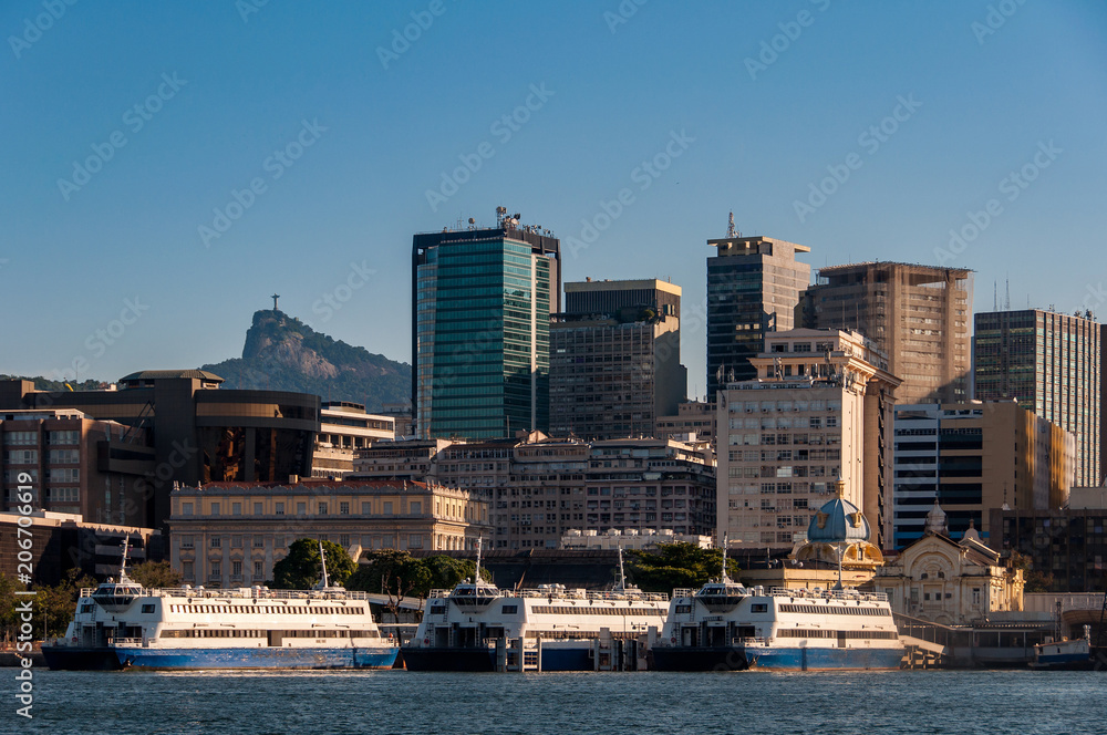 Skyline of Rio de Janeiro City Downtown With Corcovado Mountain in Background and Passenger Ferry Boats in Guanabara Bay