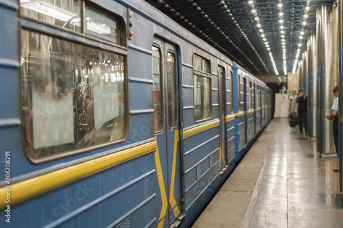 Metro train on the platform. Blue subway train on the underground station. selected focus.