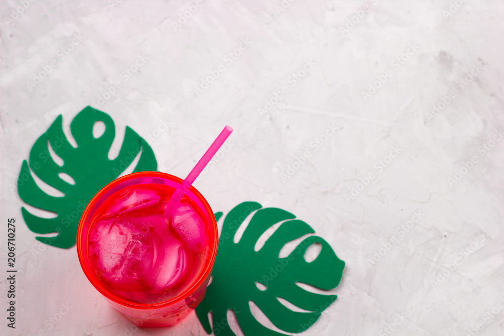 top view summer coctail ,paper cut monstera leaves, copy space top view summer coctail ,paper cut monstera leaves, copy space