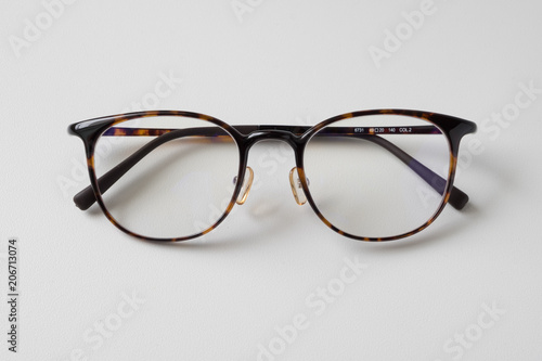 Front view of reading glasses with tortoiseshell frames on white background