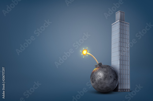 3d rendering of a giant iron bomb with a lit fuse stands dangerously close to a tall office building.