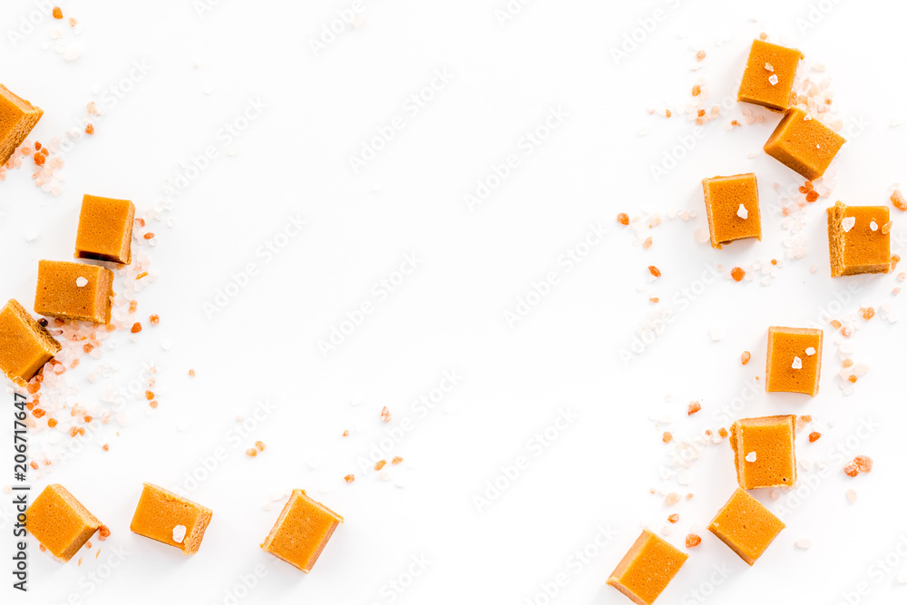Trendy dessert. Salted caramel. Caramel cubes sprinkled by salt